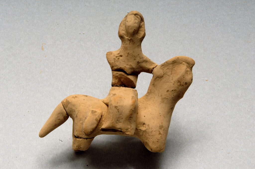 Female rider figurine