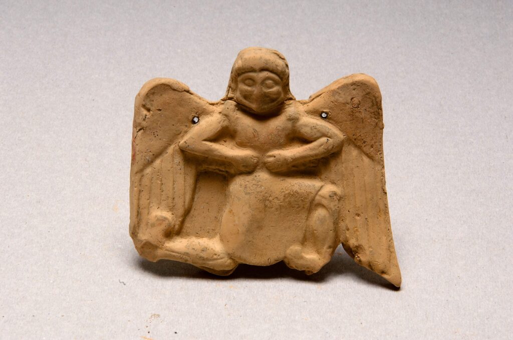 Clay plaque depicting a Gorgon