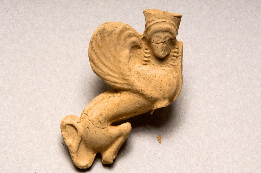 Clay plaque depicting a sphinx