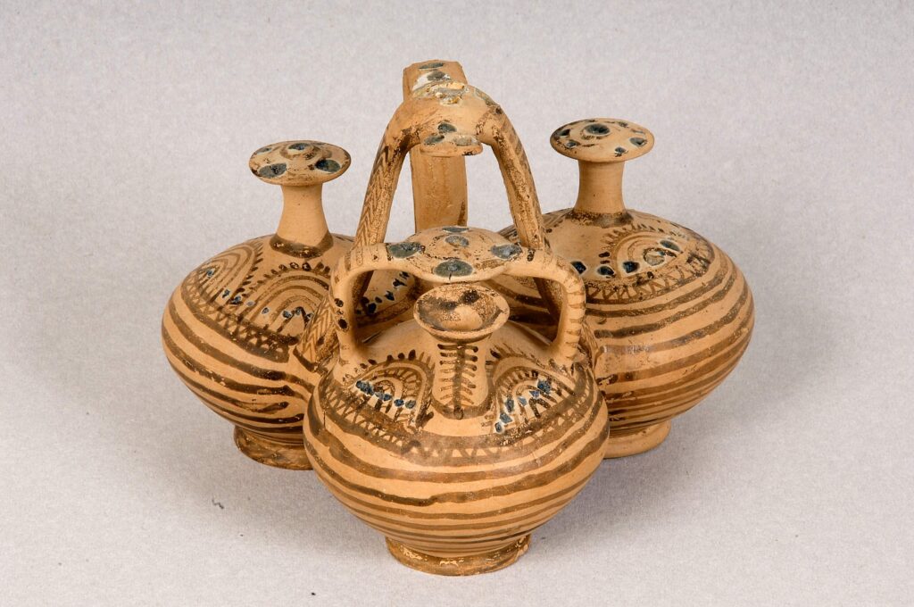 Composite clay vessel with glass-paste decoration