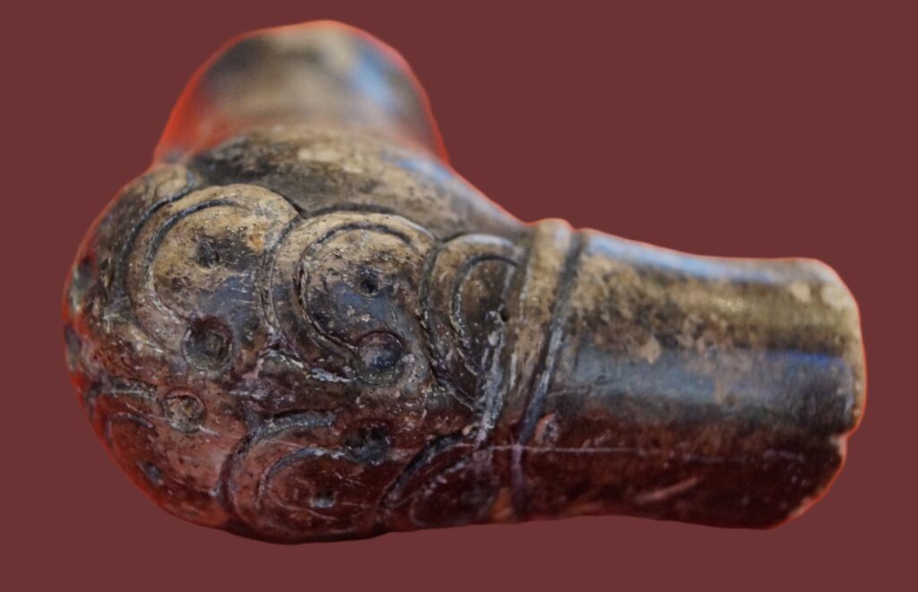 Bowl of an Ottoman tobacco pipe (ΗΔ494). The bowl held the tobacco at the end of a çubuk, a long-stemmed pipe. Such bowls were made from fine clay or lightweight sepiolite. Their plant decoration became increasingly elaborate during the 18th century.