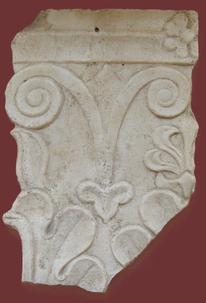 Carved capital facing