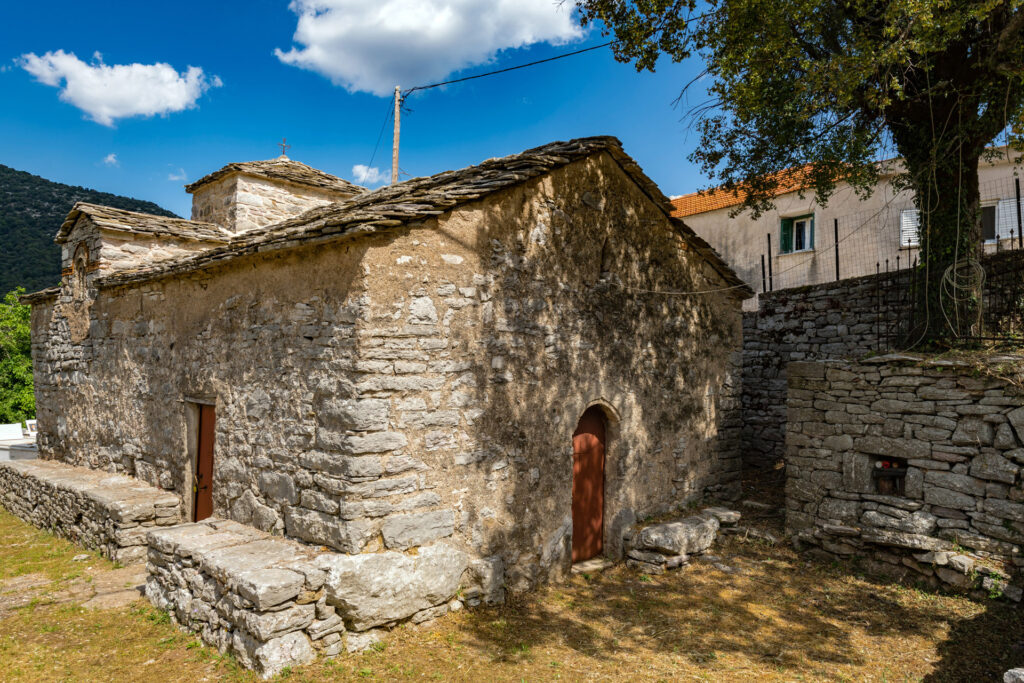 The Church of the Holy Trinity stands in the cemetery of Divri, in the Groustades or Apano Machalas neighbourhood. It is the oldest surviving monument of the village and the wider mountainous area of eastern Ilia. Its history extends from the 14th-century Palaiologan period to Ottoman times. The surviving wall paintings have two layers: the original Late Byzantine decoration of the 14th century and a later Post-Byzantine layer.