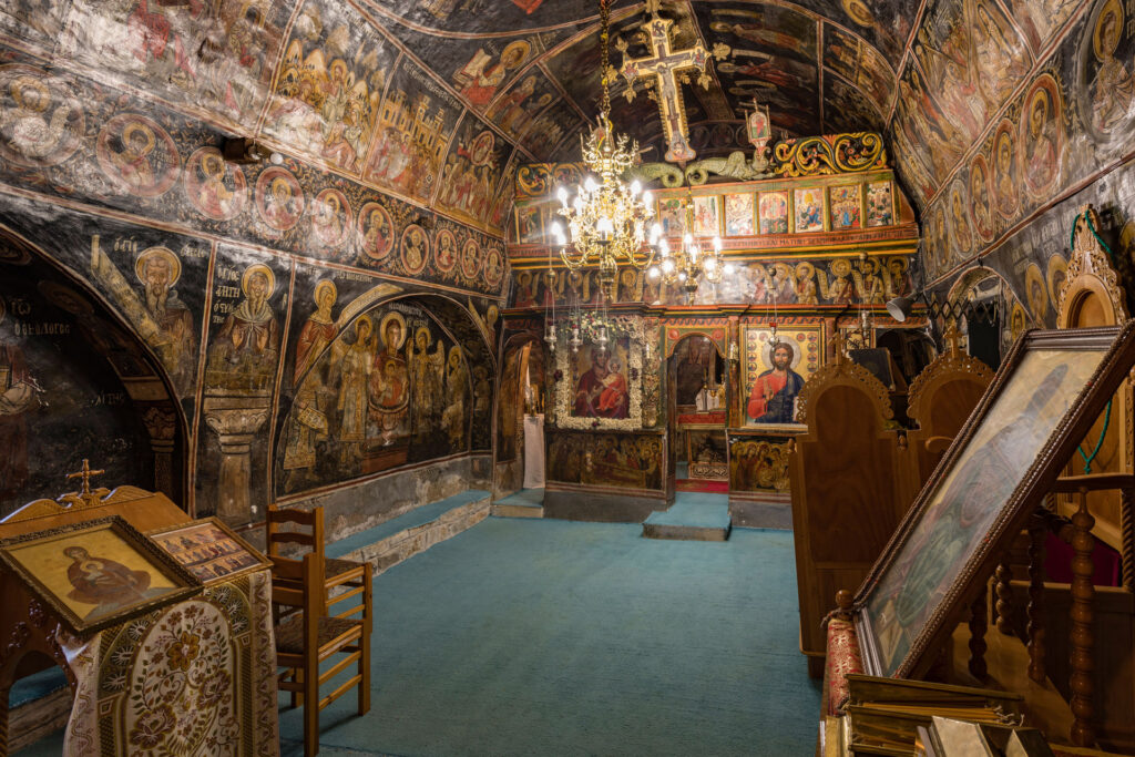 The Monastery of Panagia Chrysopigi, also known as Ano Moni or the Upper Monastery, stands northeast of Divri, modern Lampeia, in the municipality of Ancient Olympia. Its church preserves an almost complete cycle of wall paintings dated 1667; the church itself may also have been built that year.