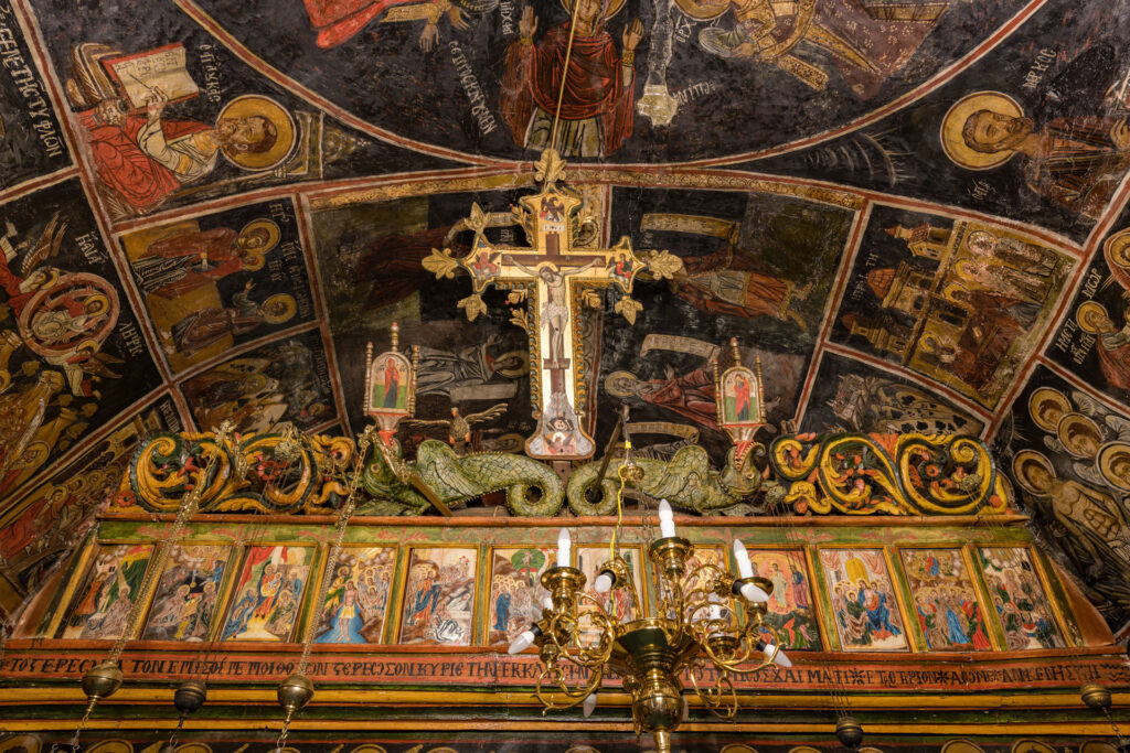The Monastery of Panagia Chrysopigi, also known as Ano Moni or the Upper Monastery, stands northeast of Divri, modern Lampeia, in the municipality of Ancient Olympia. Its church preserves an almost complete cycle of wall paintings dated 1667; the church itself may also have been built that year.